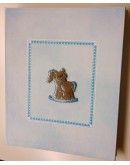 Album celeste con cavallo a dondolo